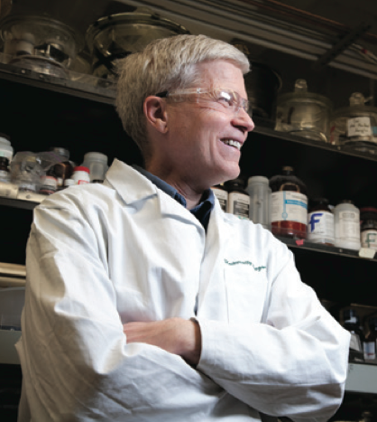 A man wearing a lab coat in a laboratory