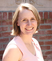 A woman in front of a building