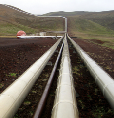 Pipes crossing open, hilly land