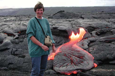 A woman near molten, fiery lava