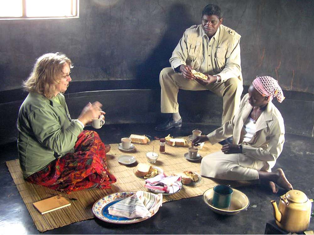 Two women and a man enjoy a meal