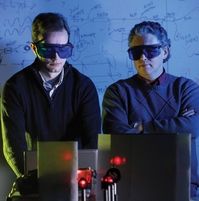 Two men in a laboratory with lasers