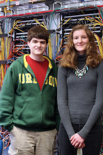 Young man and young woman in computer science laboratory