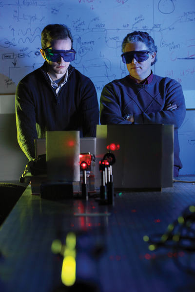 Two men in a laboratory with lasers